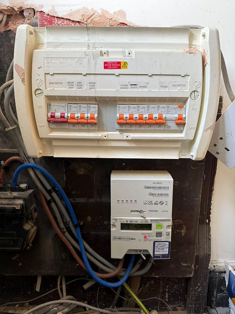 The old consumer unit before replacement, one RCD covering half the house